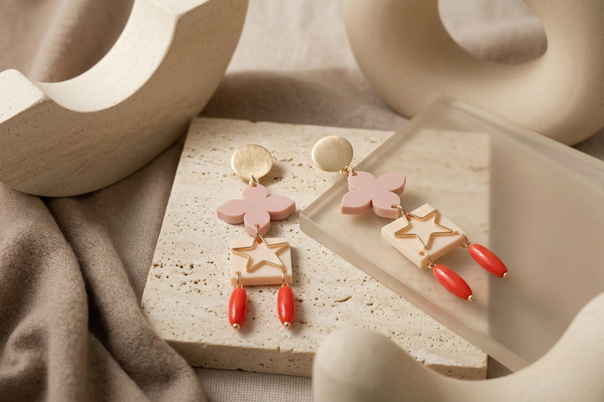 Beige Rose floral star drop earrings in a styled product setting