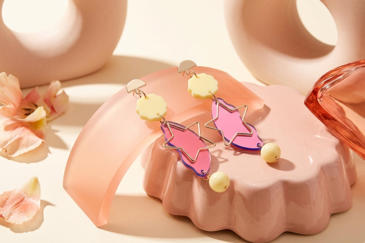 HB Sara long star dangle earrings in a styled product setting