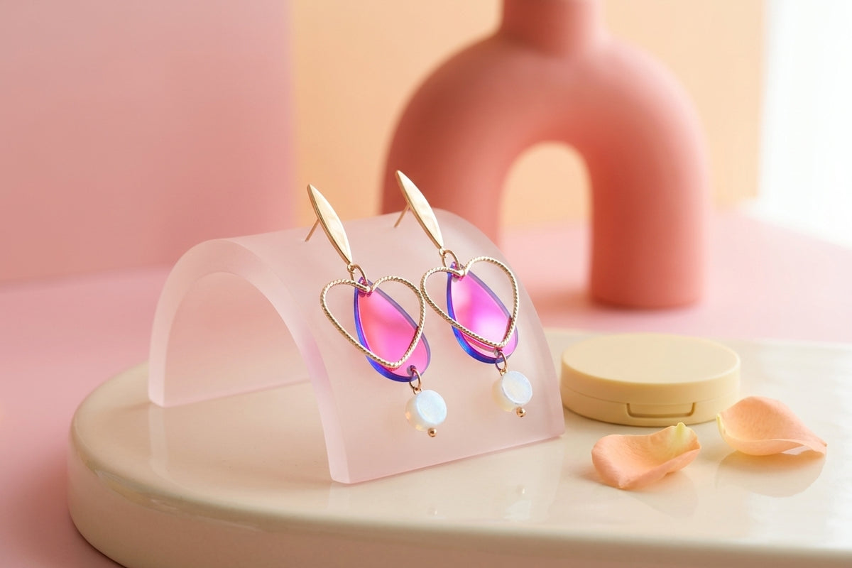 HB Sofia heart teardrop dangle earrings in a styled product setting