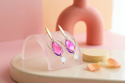 HB Sofia heart teardrop dangle earrings in a styled product setting