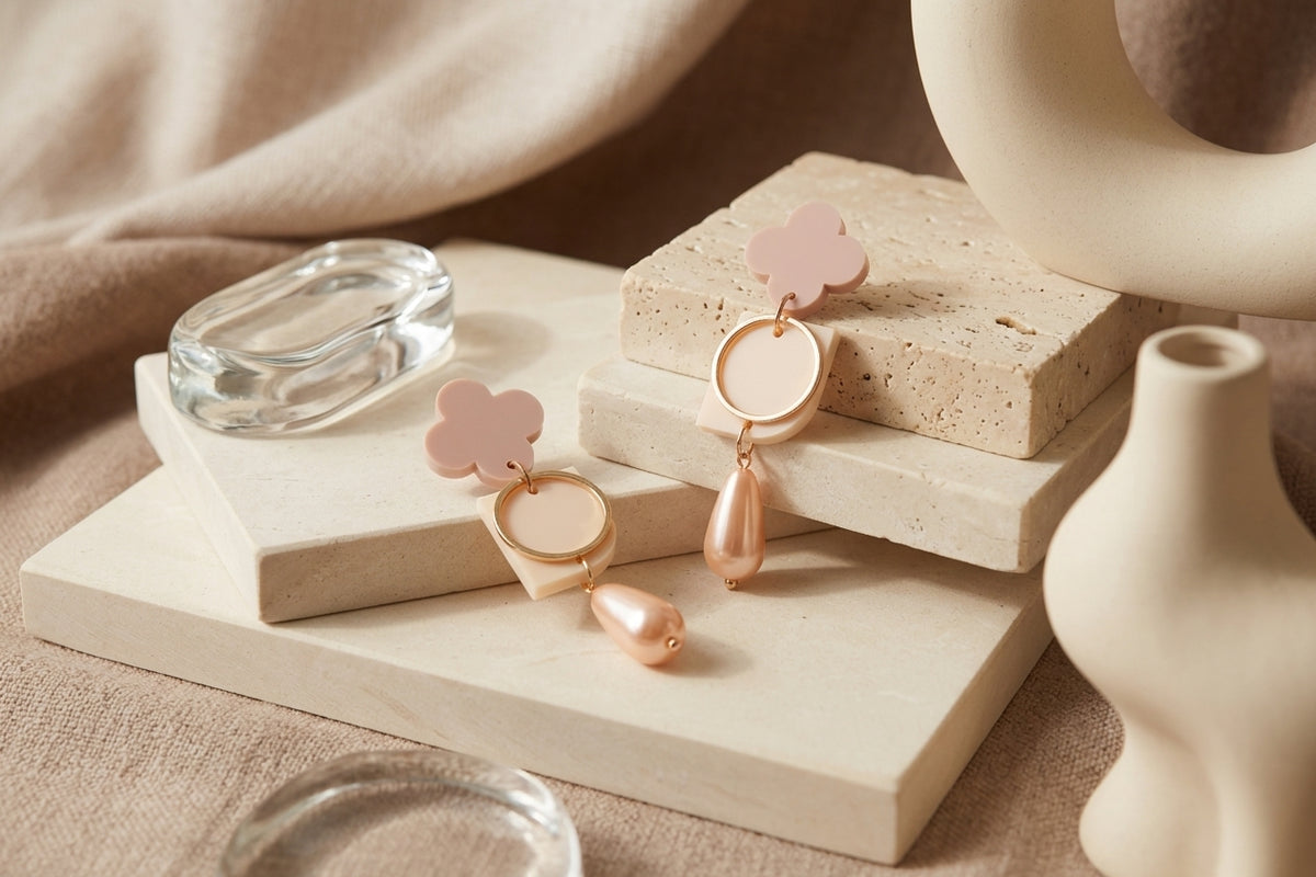 Beige Zoe floral geometric drop earrings in a styled product setting