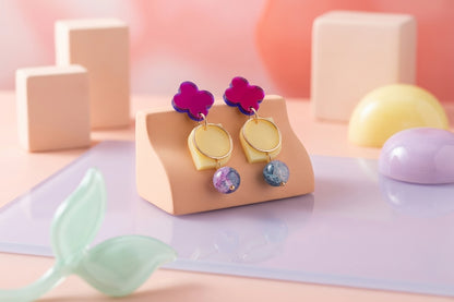 HB Zoe floral geometric drop earrings in a styled product setting